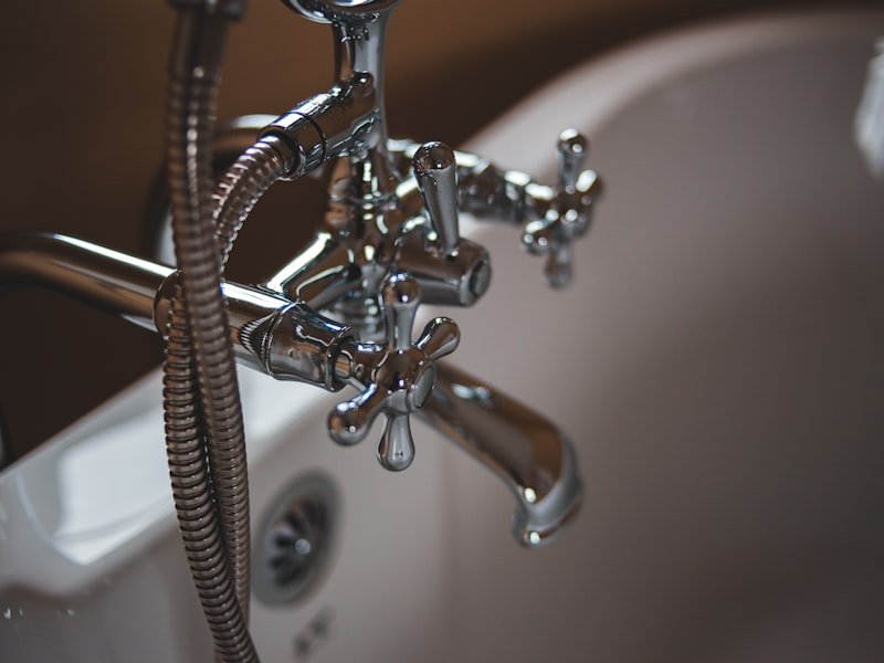 Vintage chrome fixtures restored on a clawfoot tub — Glebe heritage home.